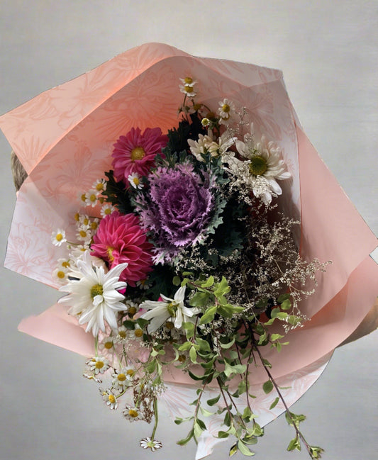 Our Dreamy fresh bouquet is a combination of pretty, pastel blooms. A mix of impressive seasonal flowers, florist choice depending on availability. This bouquet is sure to impress.  Large or Medium options available.